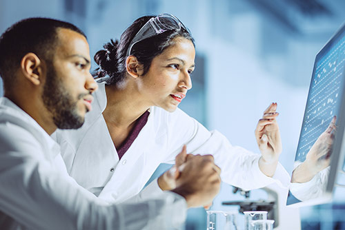 A woman presenting at a conference