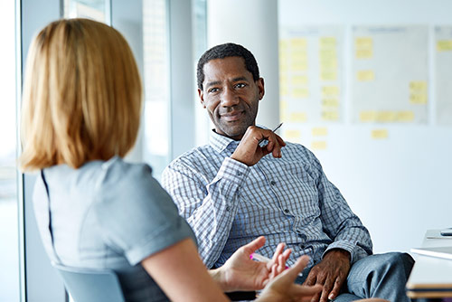 A woman presenting at a conference