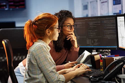 A woman presenting at a conference