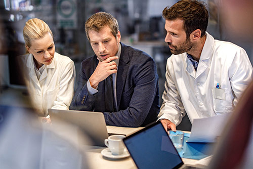 A woman presenting at a conference