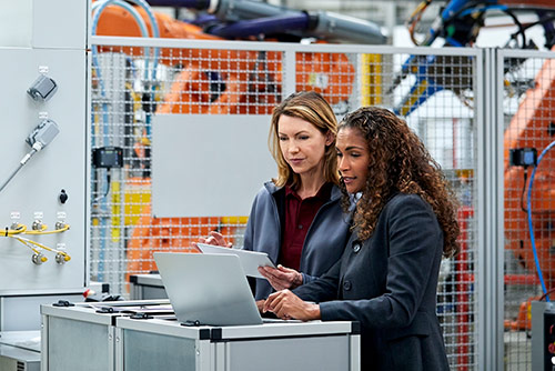 A woman presenting at a conference